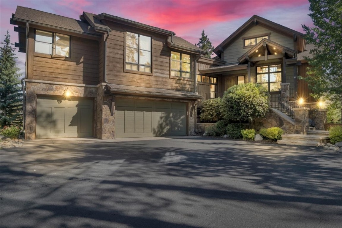 Professional listing photograph highlighting the warm lighting, stonework, and mountain setting of 73 Last Chance Lane.