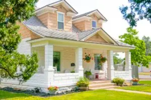 Home appraisal cost breakdown showing appraiser evaluating a residential property in 2026
